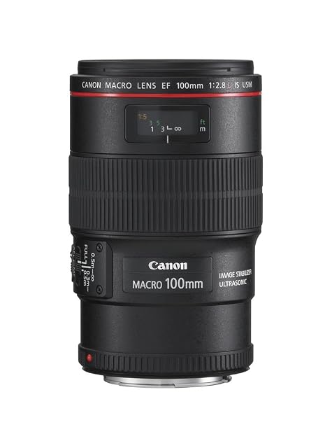 Objetivo macro Canon EF 100mm L IS negro con su anillo rojo L y el interruptor del limitador de enfoque