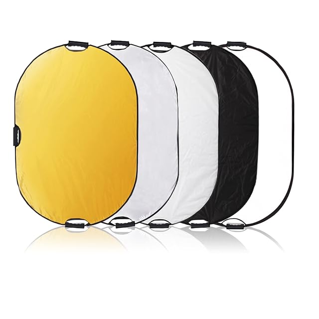 Reflector ovalado cinco en uno Selens mostrando sus tres asas y su superficie dorada